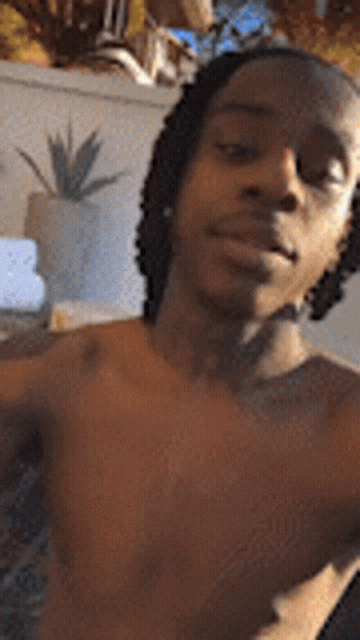 Shirtless Man With Dreadlocks Taking Selfie GIF