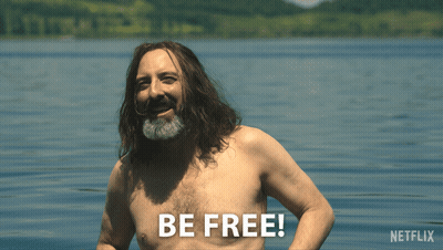 Shirtless Man With Long Hair And Beard In Water Saying Be Free GIF
