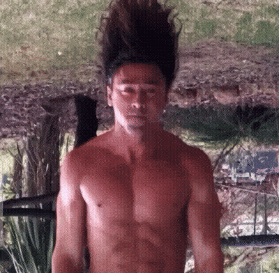 Shirtless Man With Long Hair In Front Of Mirror GIF