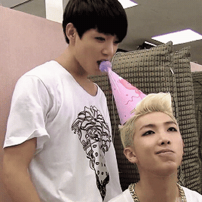 Shirtless Man With Microphone Standing Next To Another Man GIF