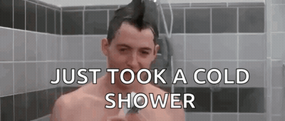 Shirtless Man With Mohawk Taking Cold Shower GIF