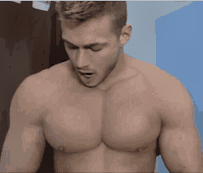 Shirtless Man With Mouth Open Looking Down