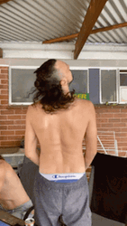 Shirtless Man With Mullet Hair Shaking Head GIF