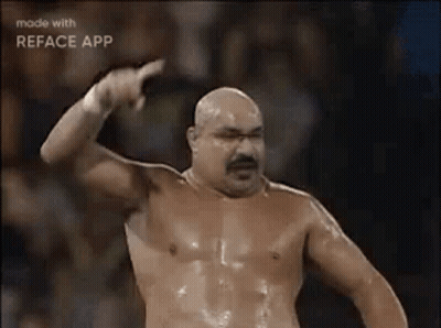 Shirtless Man With Mustache Pointing At Camera GIF