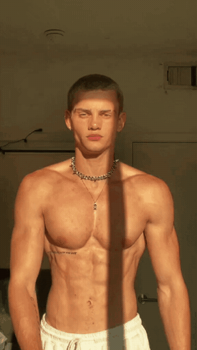 Shirtless Man With Necklace And I Love You Tattoo GIF