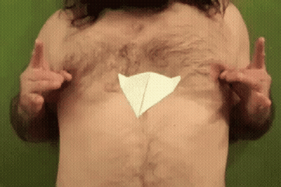 Shirtless Man With Paper Airplane On Chest GIF