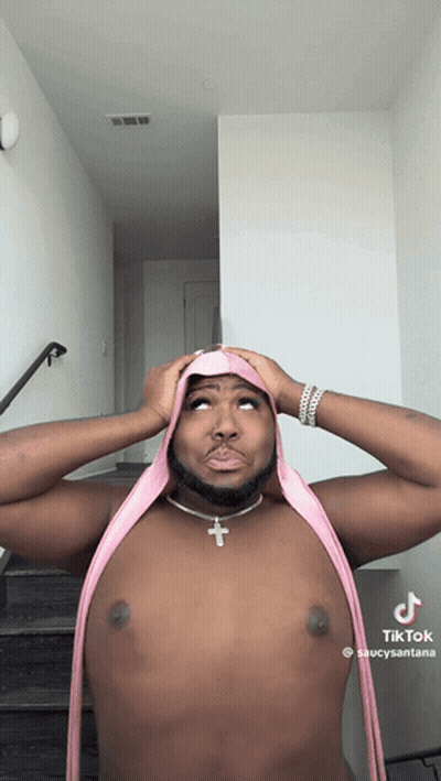 Shirtless Man With Pink Scarf And Cross Necklace GIF