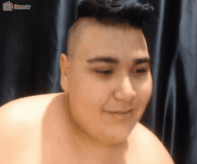 Shirtless Man With Shaved Head Smiling At Ometv Screen GIF