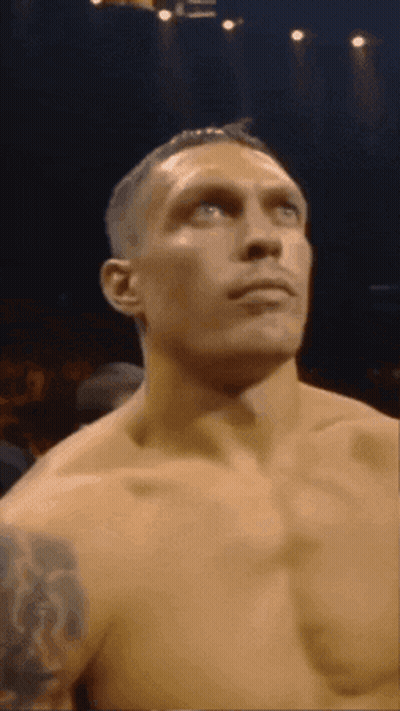 Shirtless Man With Tattoo Looking Up GIF