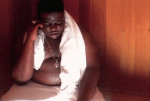 Shirtless Man With Towel Around Neck Talking On Cell Phone GIF