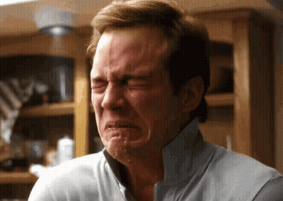 Shirtless Red-Haired Man Talking Into Microphone Making Funny Face GIF