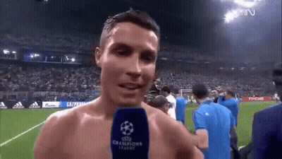 Shirtless Soccer Player Talking Into Microphone GIF
