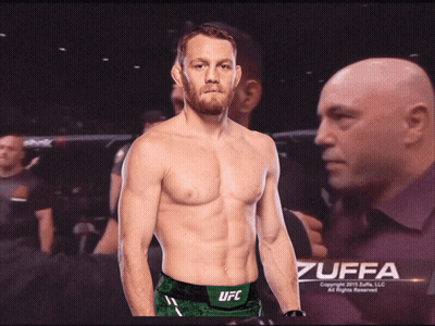 Shirtless UFC Fighter In Front Of Bald Man Poster GIF