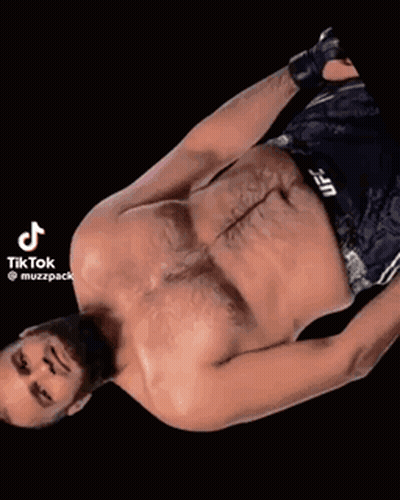Shirtless UFC Fighter Laying Down With Lightning Eyes GIF