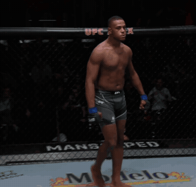 Shirtless UFC Fighter Yelling In Cage GIF