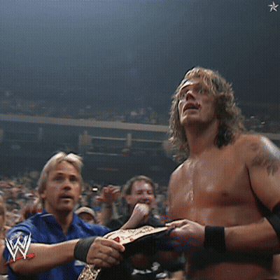 Shirtless Wrestler Hands Up In Crowd GIF