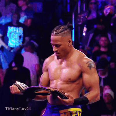 Shirtless Wrestler Holding Championship Belt GIF