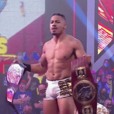 Shirtless Wrestler Holding Championship Belt GIF