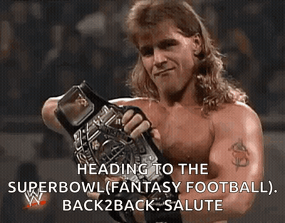 Shirtless Wrestler Holding Championship Belt GIF