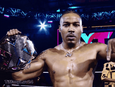 Shirtless Wrestler Holding Championship Belt GIF
