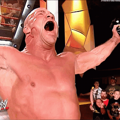 Shirtless Wrestler Holding Microphone With N On Bottom GIF