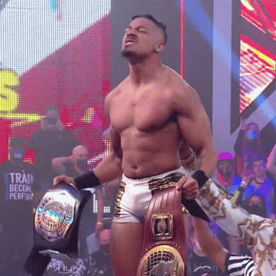 Shirtless Wrestler Holding World Heavyweight Belt GIF