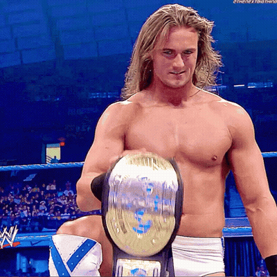 Shirtless Wrestler Holding World Heavyweight Championship GIF