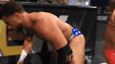 Shirtless Wrestler In Blue And White Star Spangled Trunks GIF