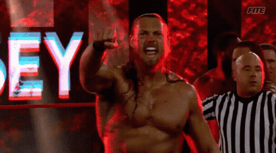 Shirtless Wrestler In Front Of Dey Sign GIF