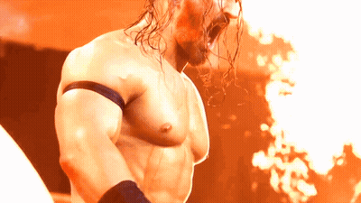 Shirtless Wrestler In Front Of Fire GIF