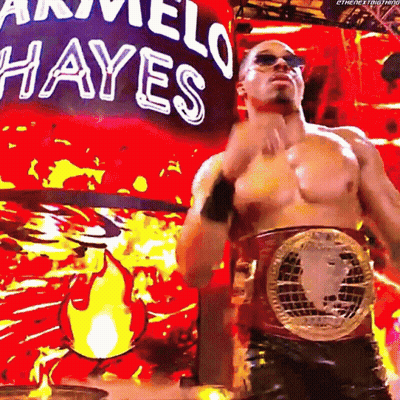 Shirtless Wrestler In Front Of Marvel Hayes Sign GIF