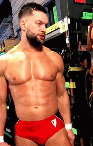 Shirtless Wrestler In Red Shorts With Letter V GIF