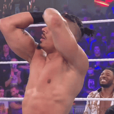 Shirtless Wrestler In Ring Hands Behind Head GIF