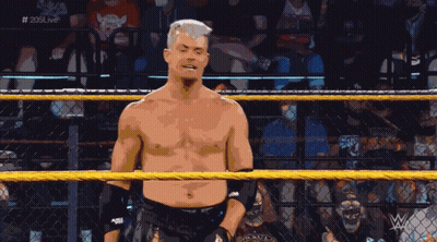 Shirtless Wrestler In Ring With 205Live On Screen GIF