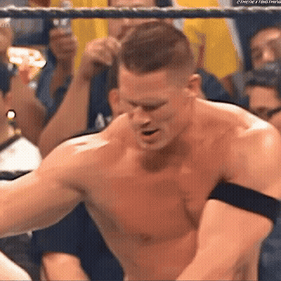 Shirtless Wrestler In Ring With Crowd GIF