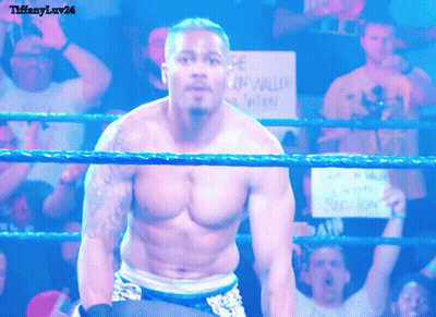 Shirtless Wrestler In Ring With Gun Violence Sign GIF