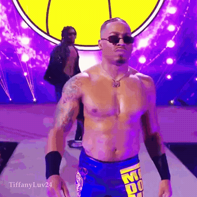 Shirtless Wrestler In Sunglasses Walking Down Purple Ramp GIF