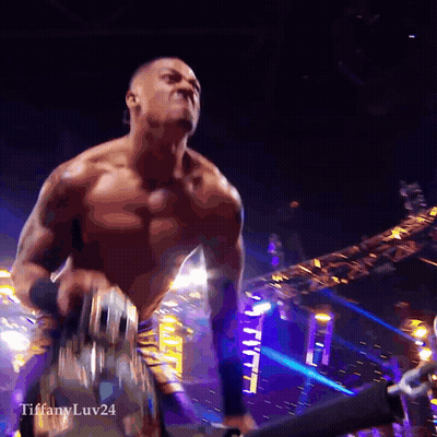 Shirtless Wrestler In Sunglasses Walking Down Purple Ramp GIF