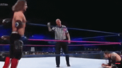Shirtless Wrestler In Wrestling Ring With Crowd GIF