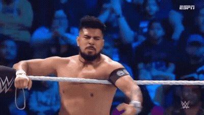 Shirtless Wrestler In Wrestling Ring With Crowd GIF