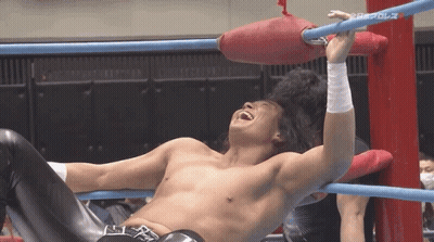 Shirtless Wrestler Laughing In Ring With Black Belt R GIF