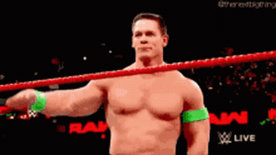 Shirtless Wrestler Saluting In Wrestling Ring GIF