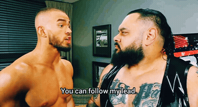 Shirtless Wrestler Saying You Can Follow My Lead To Another Wrestler GIF