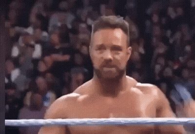Shirtless Wrestler Standing In Ring GIF