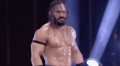 Shirtless Wrestler Standing In Spotlight GIF