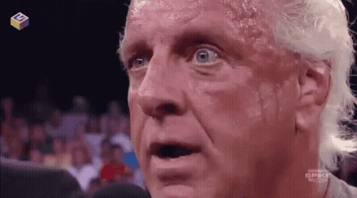 Shirtless Wrestler Talking Into Microphone GIF
