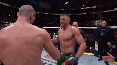 Shirtless Wrestler Talking Into Microphone GIF