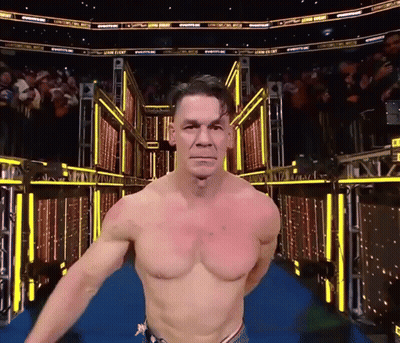 Shirtless Wrestler Walking Blue Carpet Crowd Wrestling Sign GIF