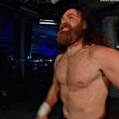 Shirtless Wrestler With Beard In Dark Room GIF