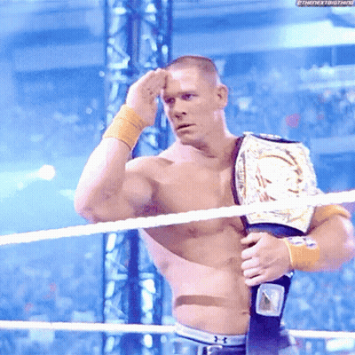 Shirtless Wrestler With Championship Belt In Ring GIF